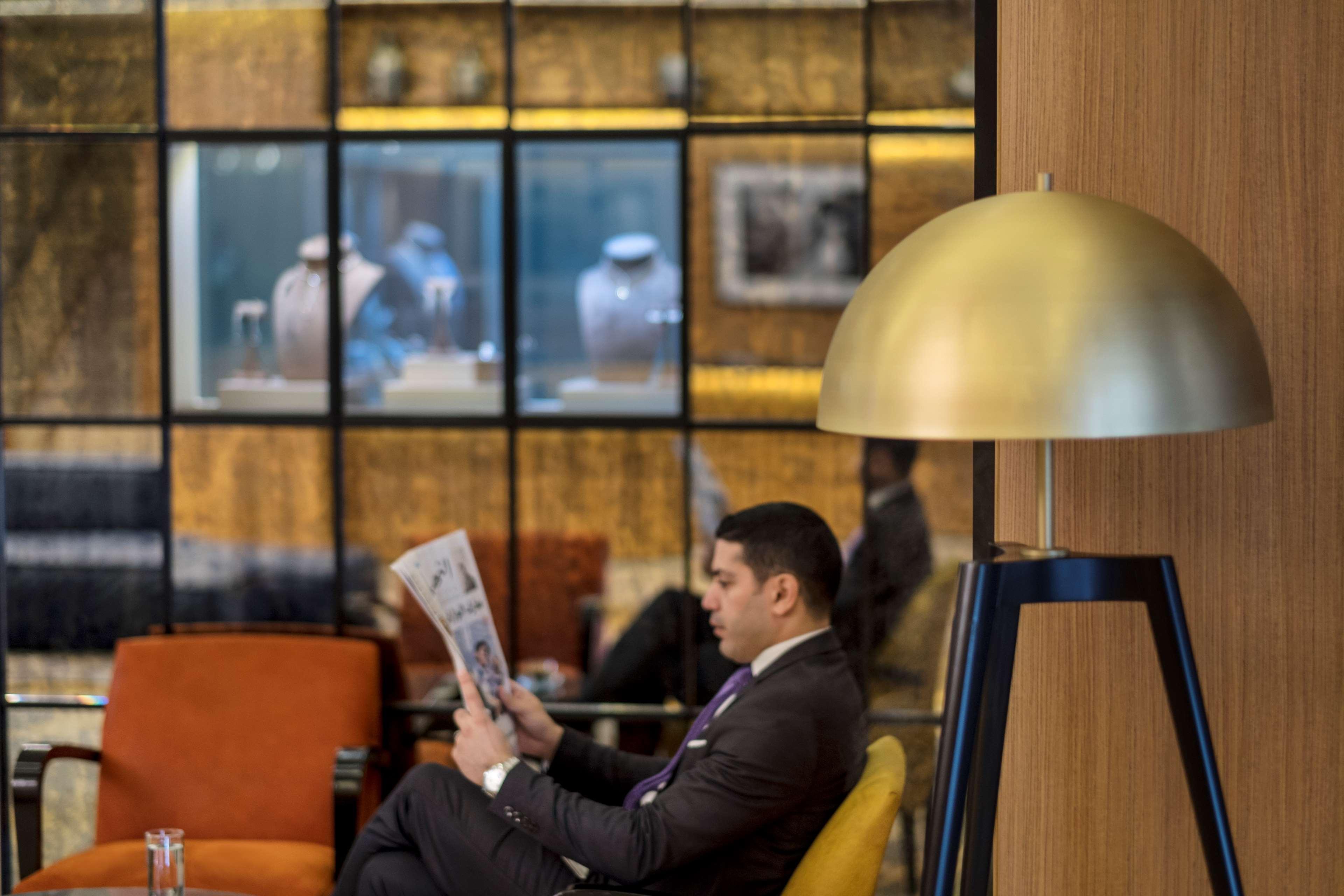 Radisson Blu Hotel, Beirut Verdun Exterior photo A passenger reading a newspaper at the lounge